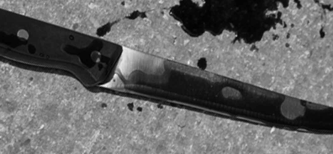 bloody knife muted in black and white photo